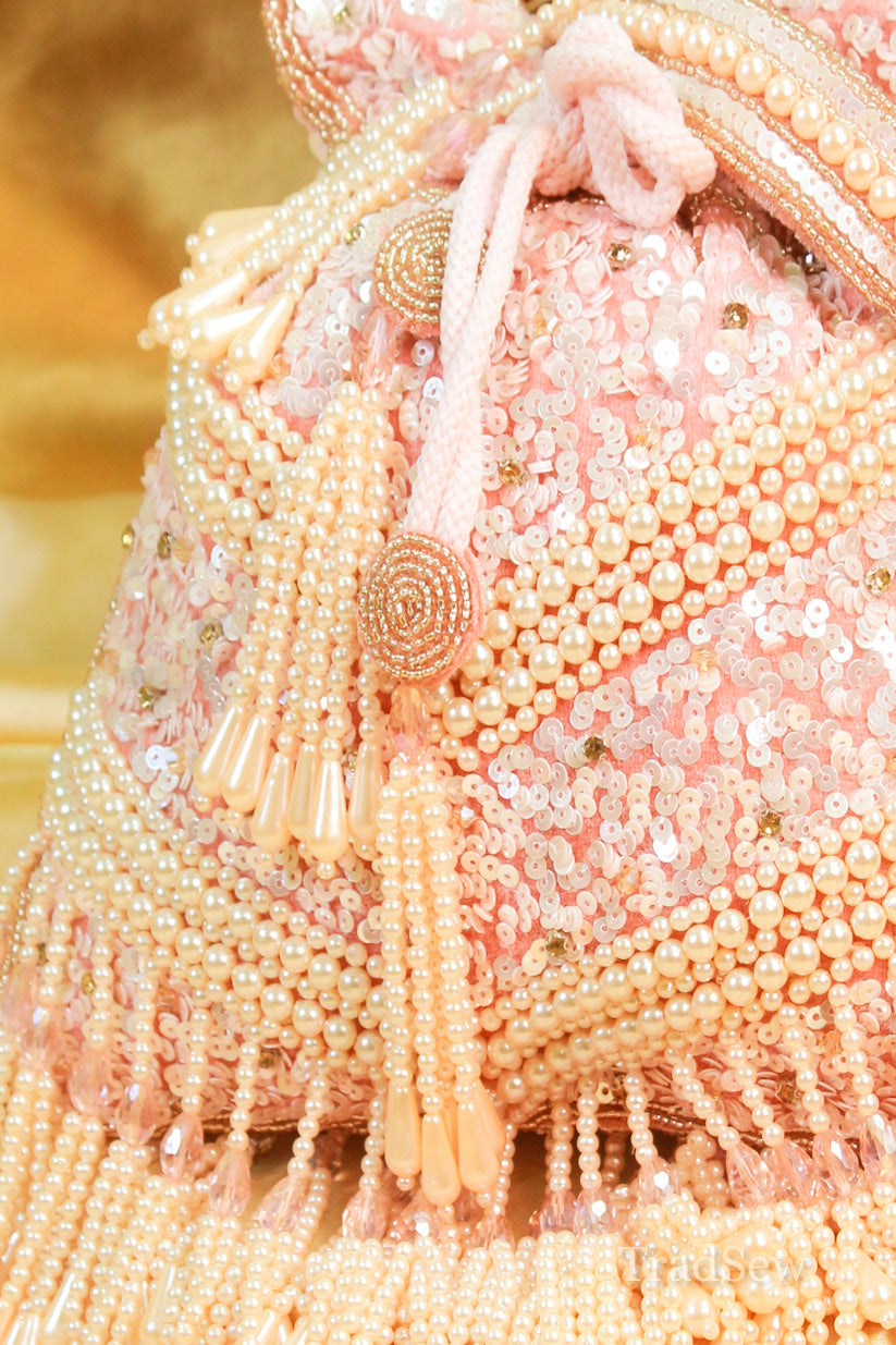 Amayra pink designer handcrafted potli handbag for wedding by tradsew