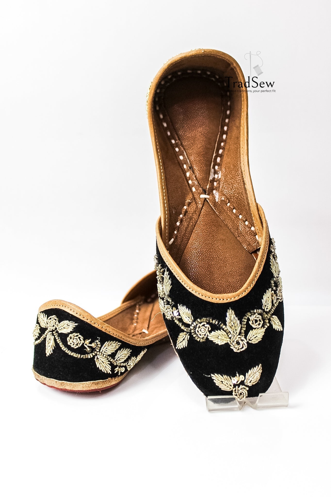 Black jutti with golden embroidery design by Tradsew