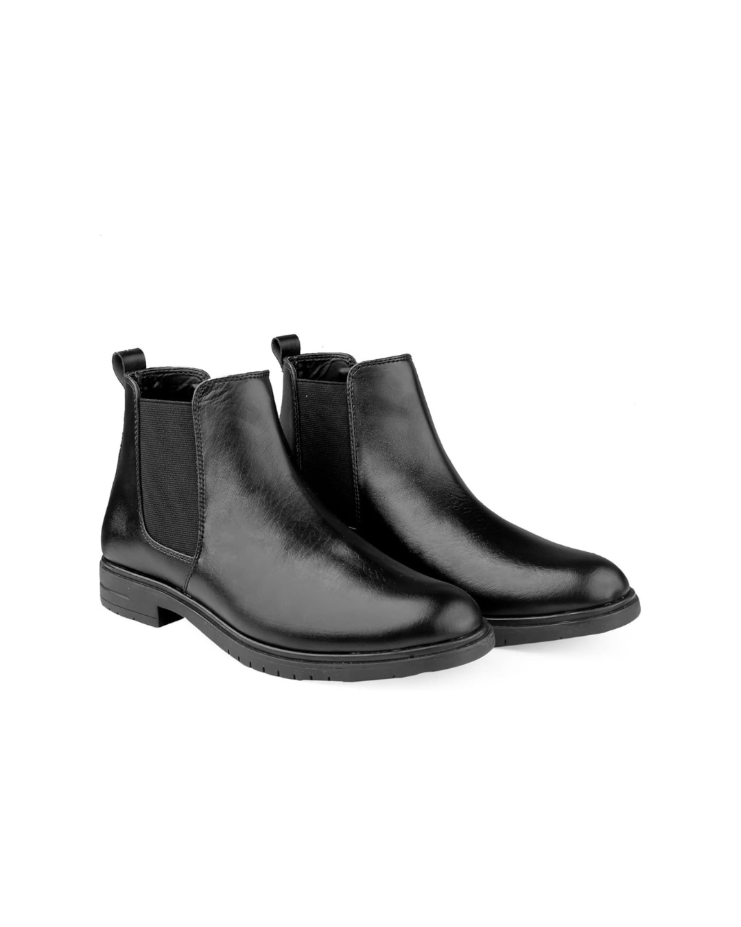 Pair of black Chelsea boots on a white background