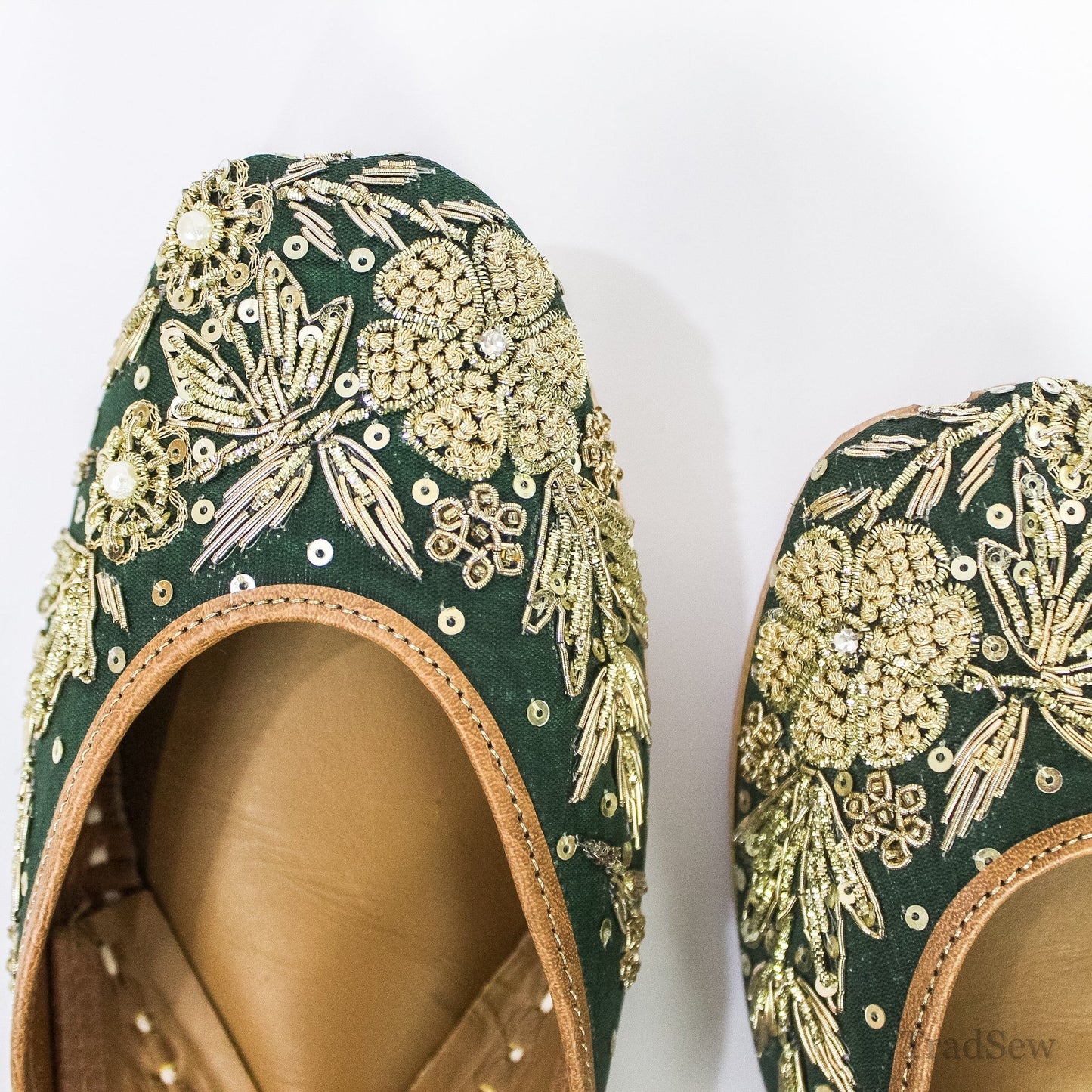 Emerald Grandeur Handcrafted Leather Juttis by Tradsew