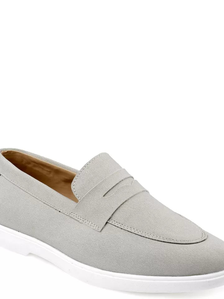 Closeup shot of Light gray loafer shoe on a white background