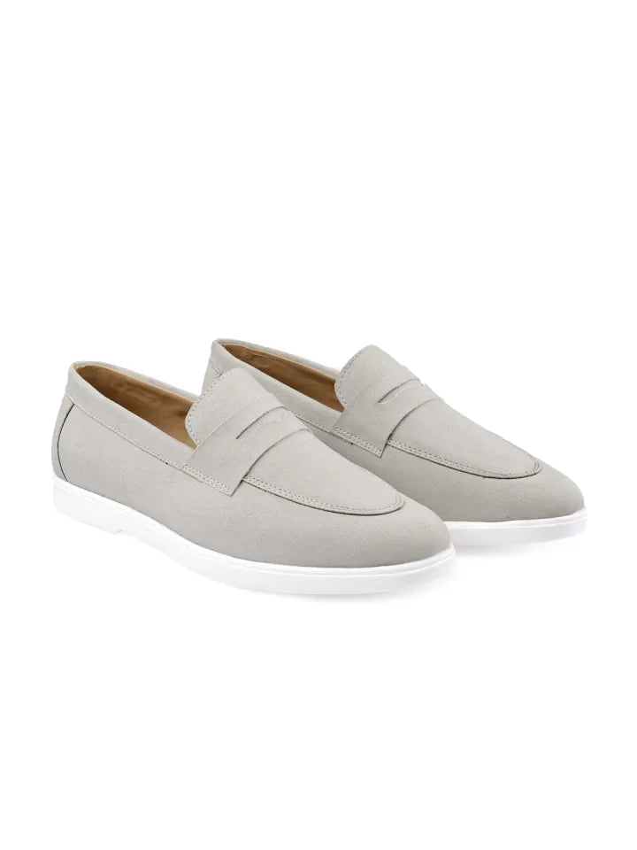 Pair of light gray loafers on a white background