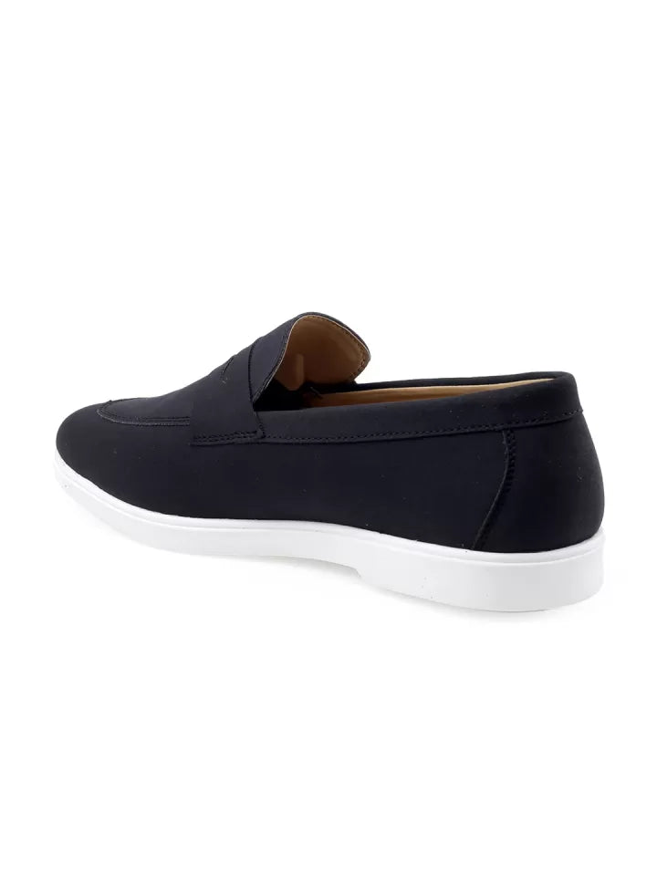 Black slip-on shoe with white sole on a white background from Tradsew