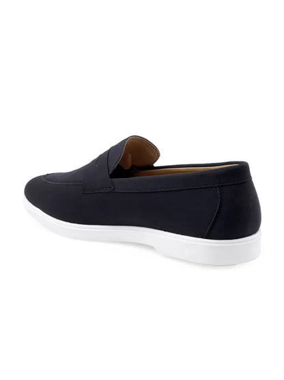 Black slip-on shoe with white sole on a white background from Tradsew