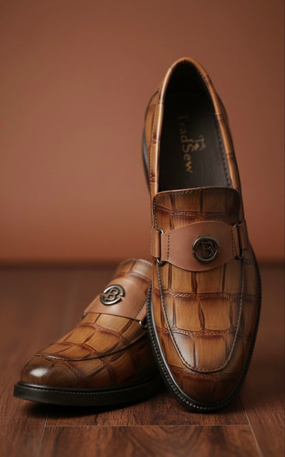 Pair of brown leather loafers on a wooden surface with a brown background