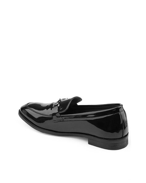 Black italian finish faux leather loafer on a white background
