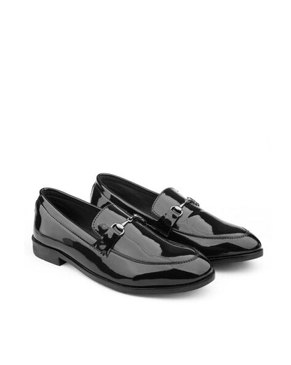 Pair of black patent leather loafers on a white background