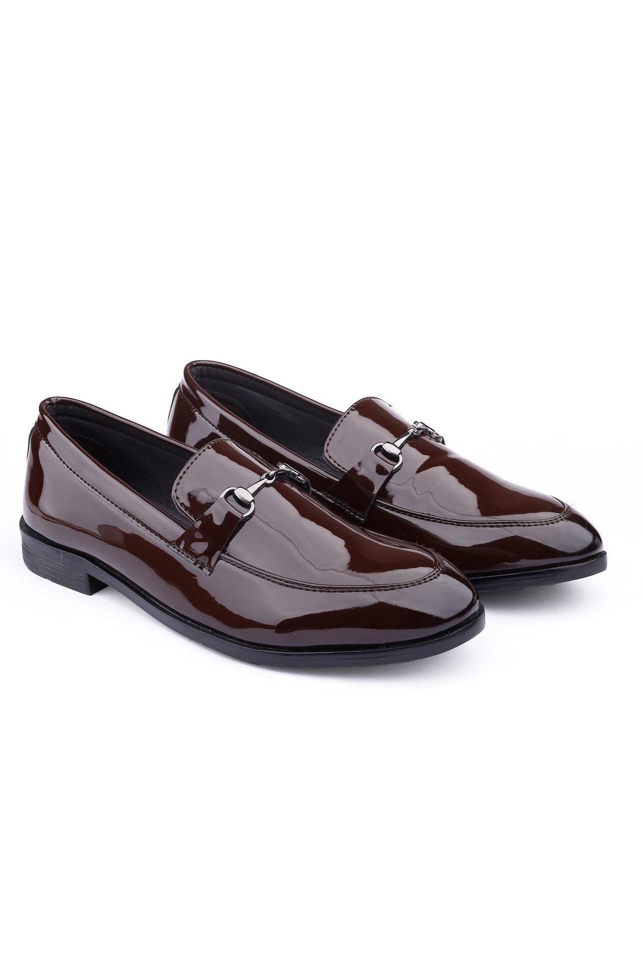 Pair of brown patent leather loafers on a white background