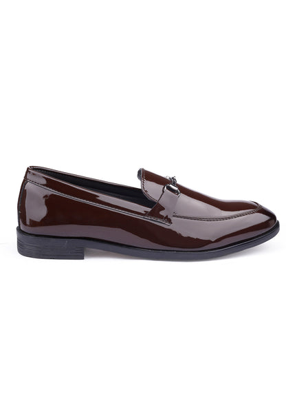 Brown patent leather loafer on a white background