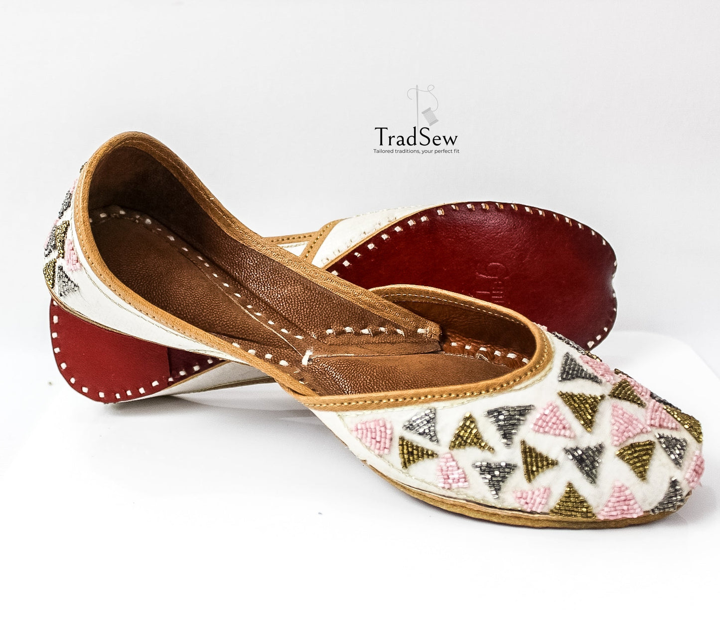 Handcrafted white triangle pattern designer jutti by Tradsew