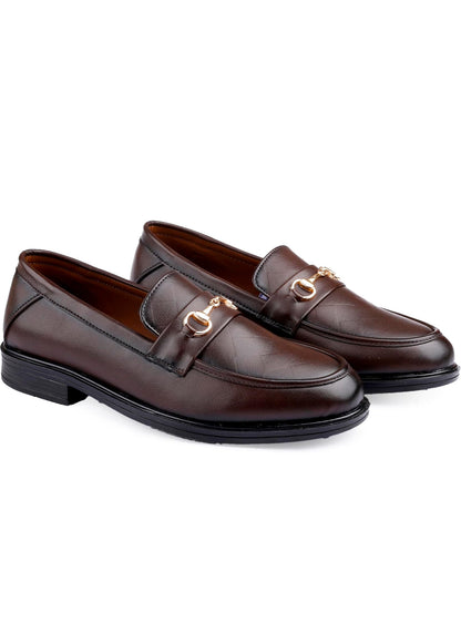 Pair of brown loafers with gold buckles on a white background