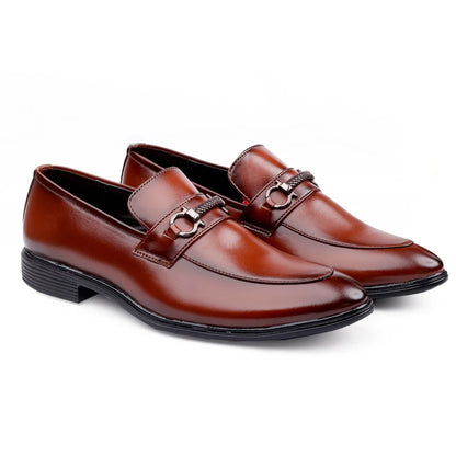 A pair of brown leather loafers with a metal buckle strap across the vamp and a black sole.