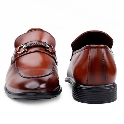 Brown leather loafers with a decorative buckle on a white background