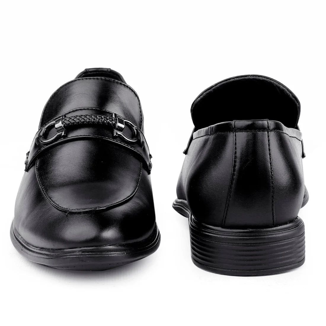 Black dress shoes with a buckle on a white background