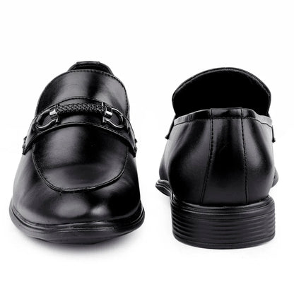 Black dress shoes with a buckle on a white background