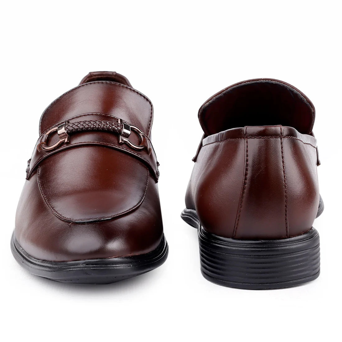 Pair of brown leather shoes with a buckle on a white background