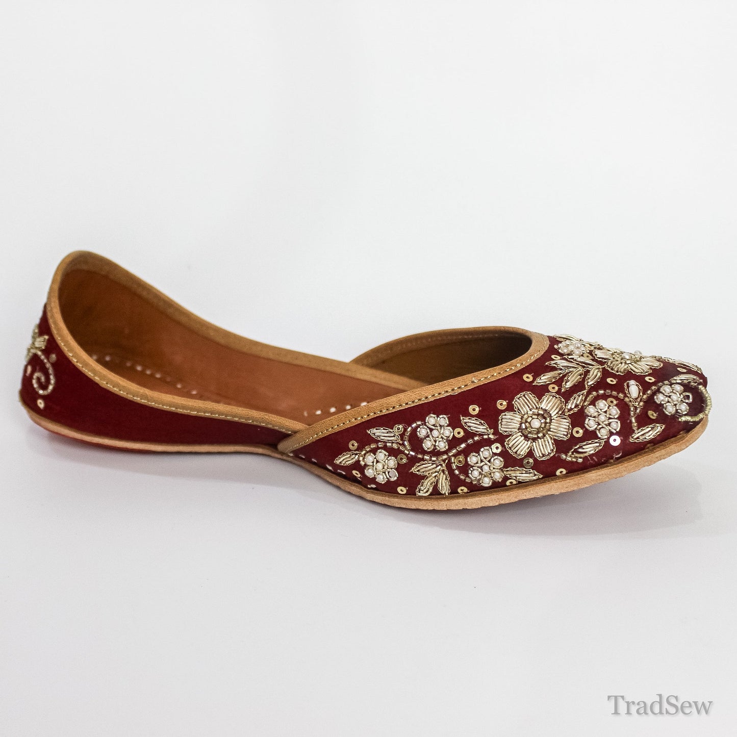 Opulent Maroon Gold-Threaded Leather Juttis by Tradsew