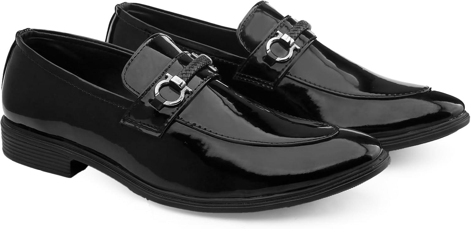 Black patent leather shoes with a silver buckle on a white background