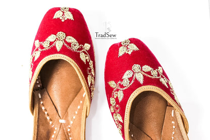 Red jutti with golden embroidery design by Tradsew