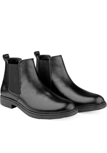 Black leather Chelsea boots on a white background