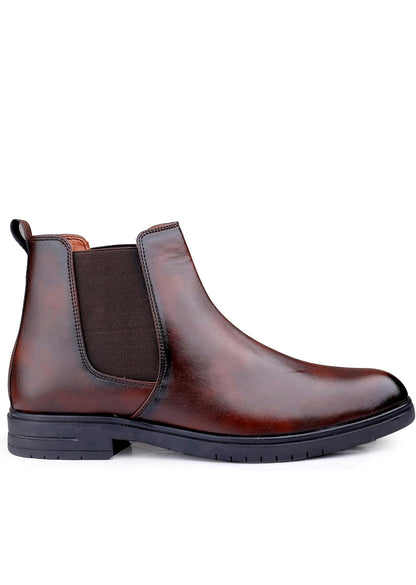 Brown leather Chelsea boot on a white background