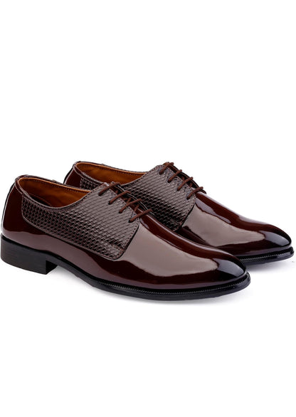 Pair of brown dress shoes on a white background